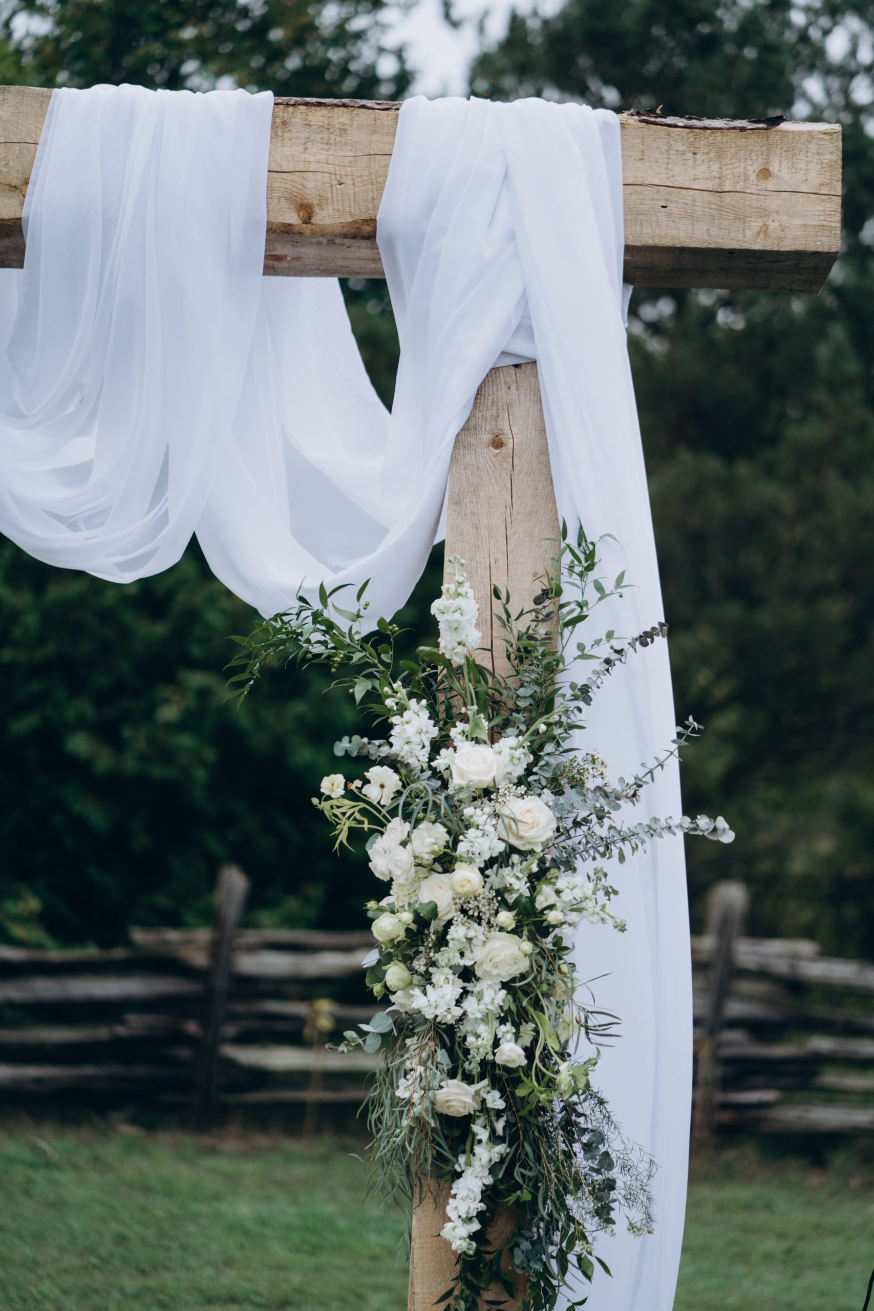 Toronto Outdoor Ceremony Wedding Planning Flowers on a Wooden Arch